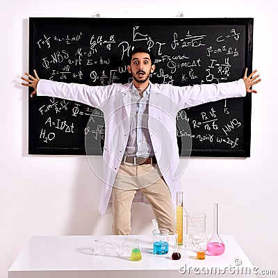 Surprised teacher at the blackboard Stock Photo