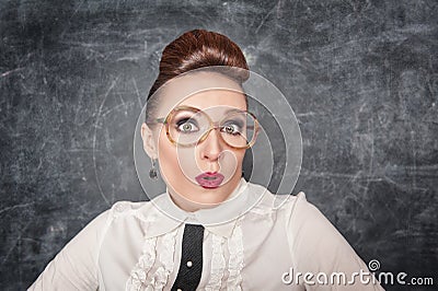 Surprised teacher with eyeglasses Stock Photo