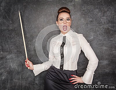 Surprised teacher with wooden pointer Stock Photo