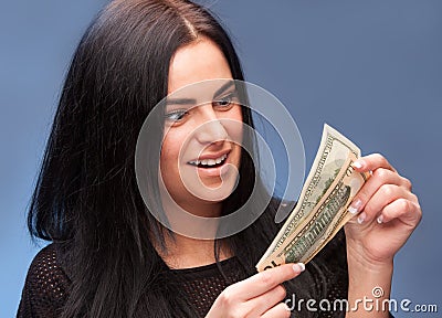 Surprised woman with dollar bills Stock Photo