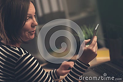 Surprised woman received SMS message Stock Photo