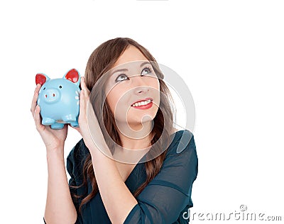 Surprised young girl with a blue money-box Stock Photo