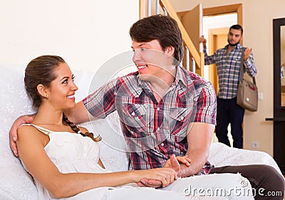 Surprised young spouse coming home Stock Photo