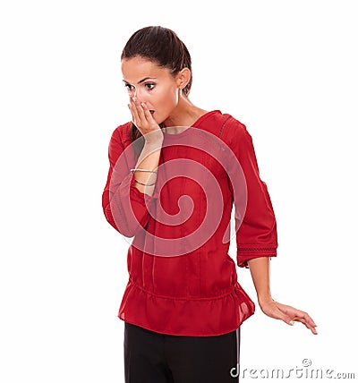 Surprised young woman closing her mouth Stock Photo