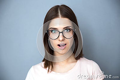 Surprised young woman in glasses Stock Photo
