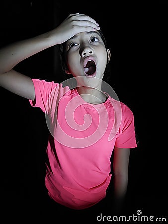 Surprised Youthful Philippina Adolescent Isolated On Black Stock Photo