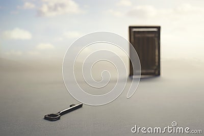 Surreal atmosphere of a key to open a closed door; concept of success, problem solving and freedom Stock Photo