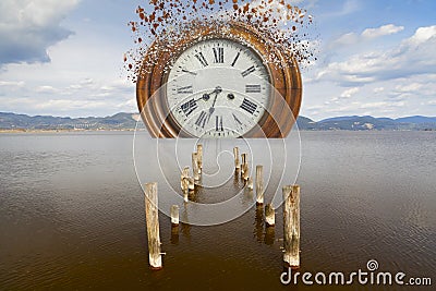 Surreal broken clock in the sea Stock Photo