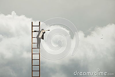 Surreal business man hanging from a ladder in the sky looks through his spyglass at the future, abstract concept Stock Photo
