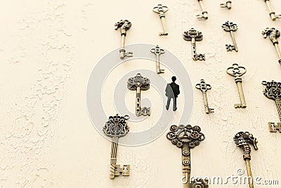 Surreal concept image of person looking at many vintage keys Stock Photo
