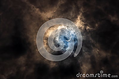 Surreal Dramatic Solar Eclipse Covered By Clouds. Natural Phenomenon Stock Photo