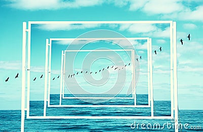 surreal enigmatic picture of flying birds and frame . beach landscape. Stock Photo