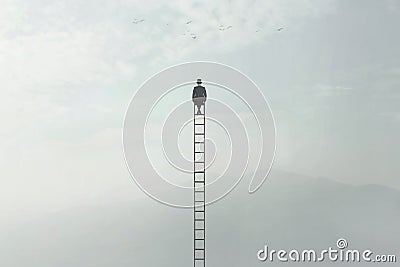 Man sitting on a very high ladder in the middle of nature Stock Photo