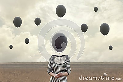 Surreal image of woman and blacks balloons flying Stock Photo