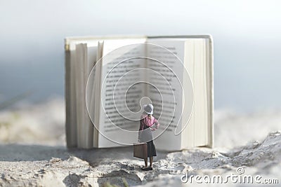 Surreal journey of a woman inside the story of an adventurous book Stock Photo