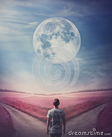 Surreal purple world with a person following the full moon, arrives in front of a crossroad, has to choose the correct way, left Stock Photo