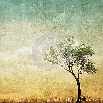 Surreal single tree on cloudy sky with copy space. Stock Photo