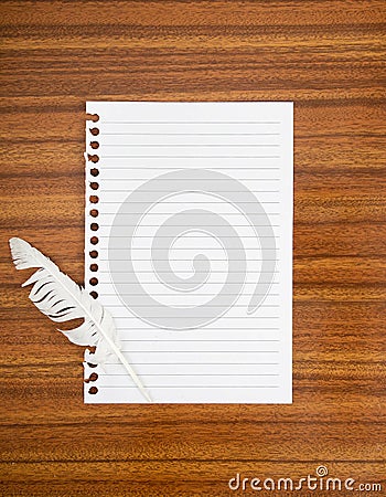 Surrender note with white feather,concept. Cowardice, defeat etc Stock Photo