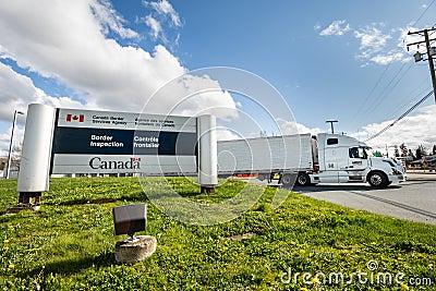 Surrey, Canada - Mar 29, 2020: Transport truck leaving border inspection station Editorial Stock Photo