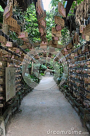 Surrounded by Ema Japanese wooden prayers in Aoshima Shrine of Miyazaki Editorial Stock Photo