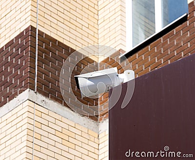 Surveillance camera mounted on the visor of the building Editorial Stock Photo
