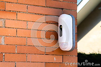 Surveillance Camera With Movement Detector on House Stock Photo