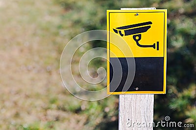 Surveillance camera sign on installed on plain board Stock Photo