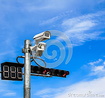 Surveillance camera and traffic light Stock Photo