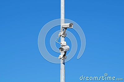 Surveillance cameras against blue sky Security Cctv Stock Photo