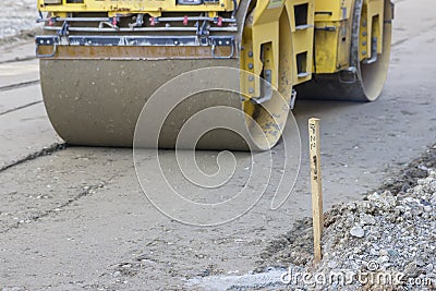 Survey stake marking the road Stock Photo