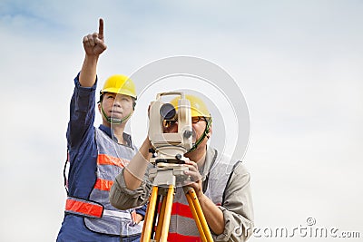 Surveyor engineer making measure with partner Stock Photo