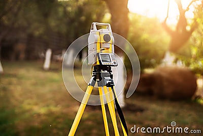 Surveyor engineering equipment with theodolite and total station in a garden Stock Photo