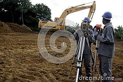 Surveyor taking measurements Editorial Stock Photo