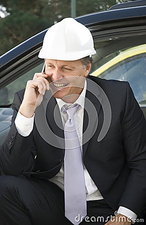 Surveyor using cellphone Stock Photo