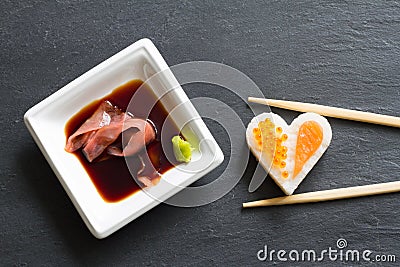 Sushi abstract seafood heart concept on black marble menu background Stock Photo