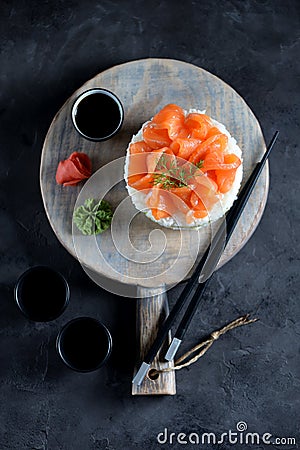 Sushi cake with lightly salted salmon, nori and avocado. Stock Photo