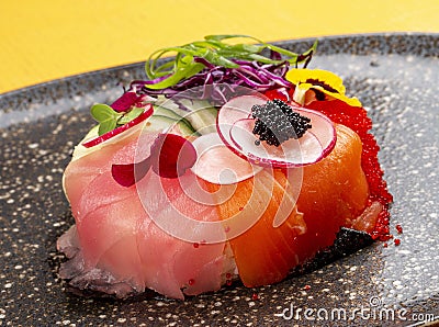 Sushi donut on a ceramic plate. Sushi trend. Creative food Stock Photo