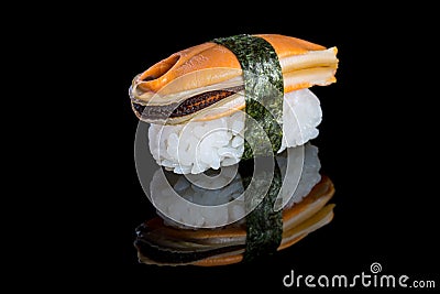 Sushi nigiri with mussel on black background with reflection. Ja Stock Photo