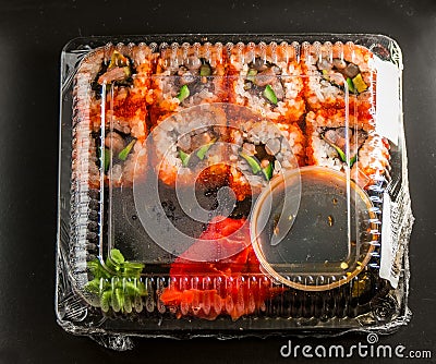 Sushi in the package on a black background Stock Photo