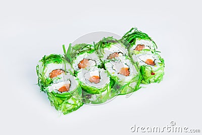 Sushi Roll wrapped in rice and Hiyashi wakame chuka chukka seaweed isolated on gray background Stock Photo