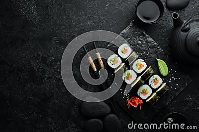 Sushi rolls with avocado and salmon. Classic Japanese sushi. Top view. Stock Photo