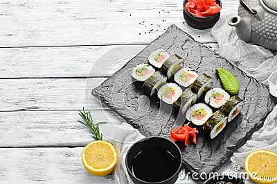 Sushi rolls with avocado and salmon. Classic Japanese sushi. Top view. Stock Photo