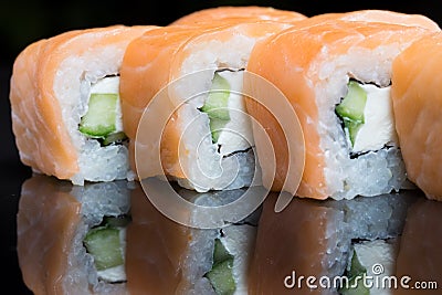 Sushi rolls philadelphia on a black background. Stock Photo