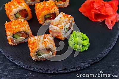 Sushi rolls Philadelphia on black slate Stock Photo