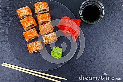 Sushi rolls Philadelphia on black slate. Top view Stock Photo