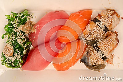 Sushi with salmon, eel, tuna, hiyashi wakame, sesame isolated Stock Photo