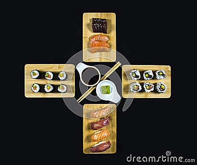Sushi Set Composition on Bamboo plate with Sushi Rolls and Wasabi on Black Background Stock Photo