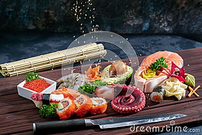 Sushi Set. Different sashimi, sushi and rolls with octopus Editorial Stock Photo