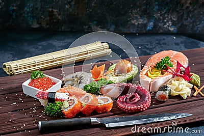 Sushi Set. Different sashimi, sushi and rolls with octopus Editorial Stock Photo