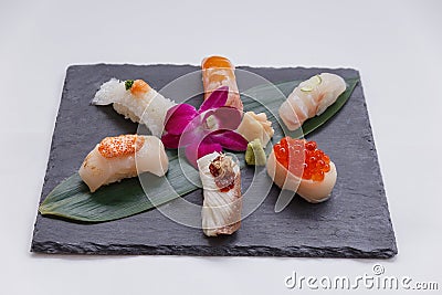 Sushi Set Include Torched Salmon, Engawa, Hotate, Hamachi, Tai and Ikura with Hirame Served with Wasabi and Prickled Ginger. Stock Photo